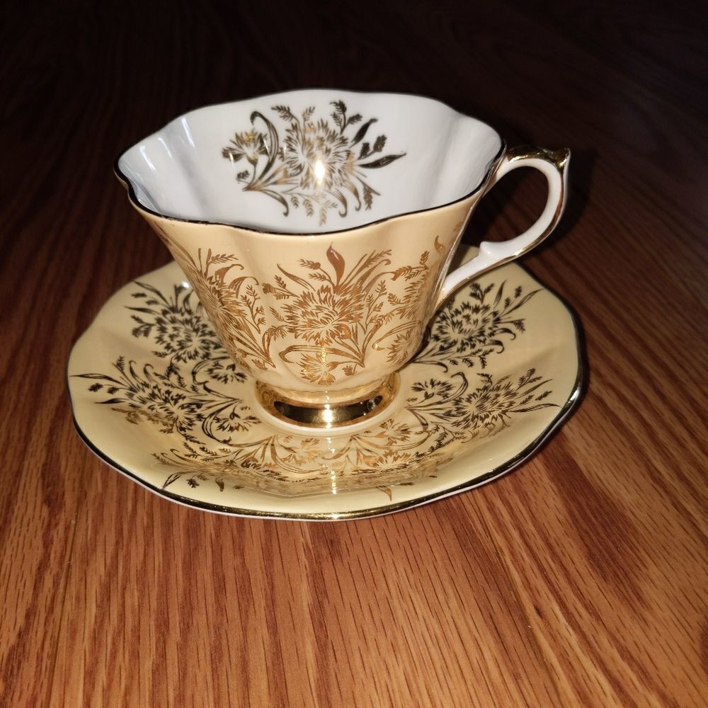 Queen anne gold floral tea cup and saucer